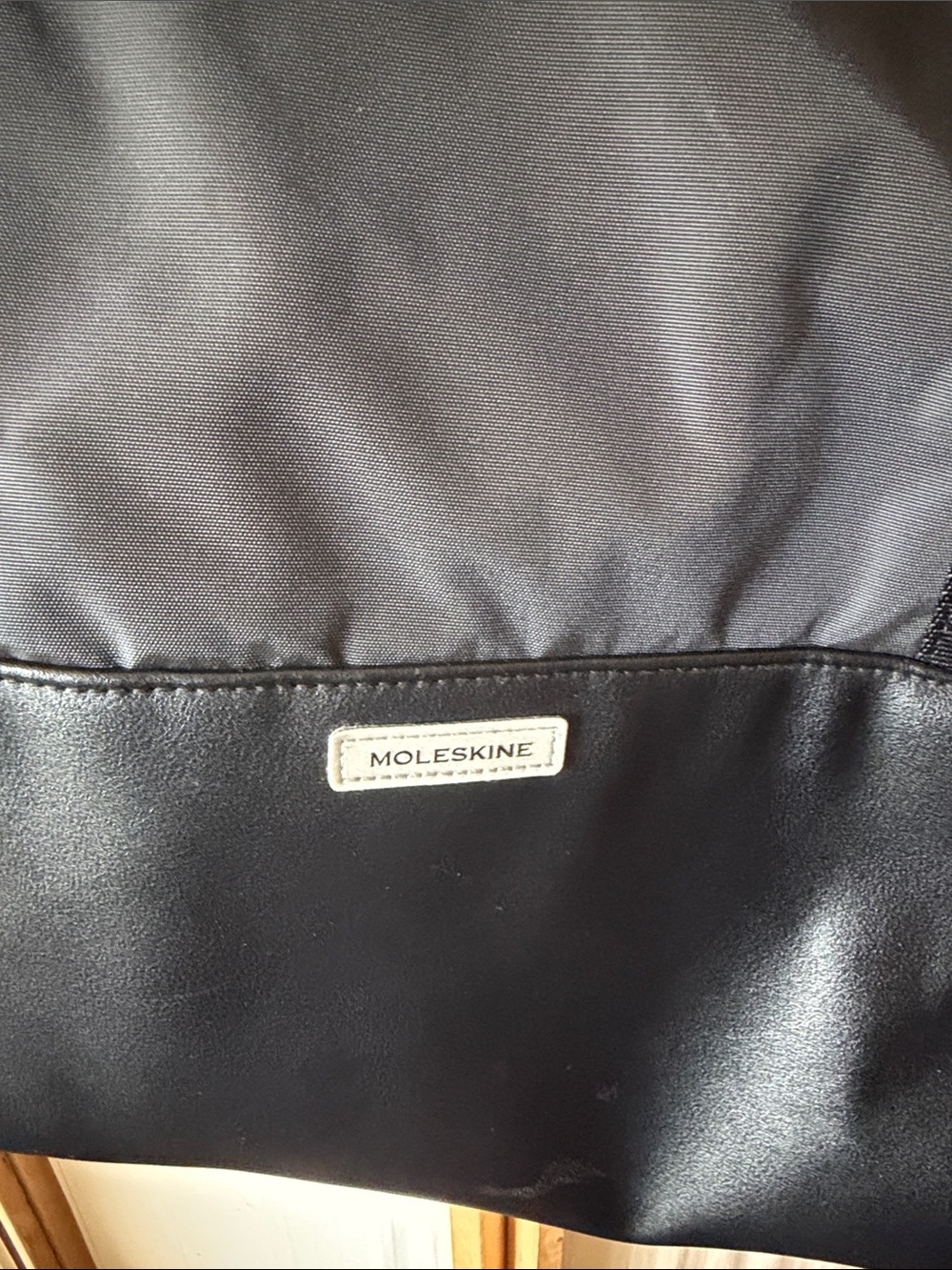 Moleskin black fold down tote.